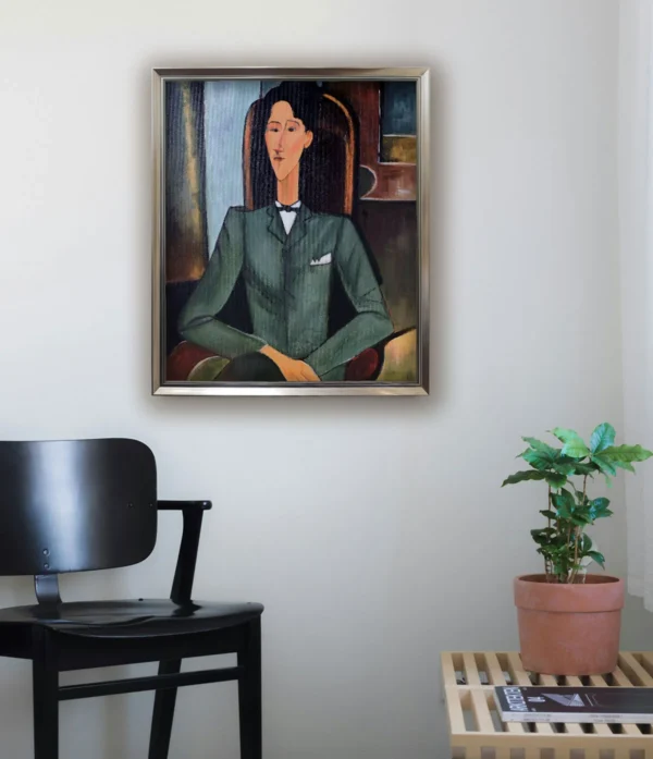 Framed reproduction of Modigliani’s "Portrait of Jean Cocteau" with silver frame, minimalist study decor display.